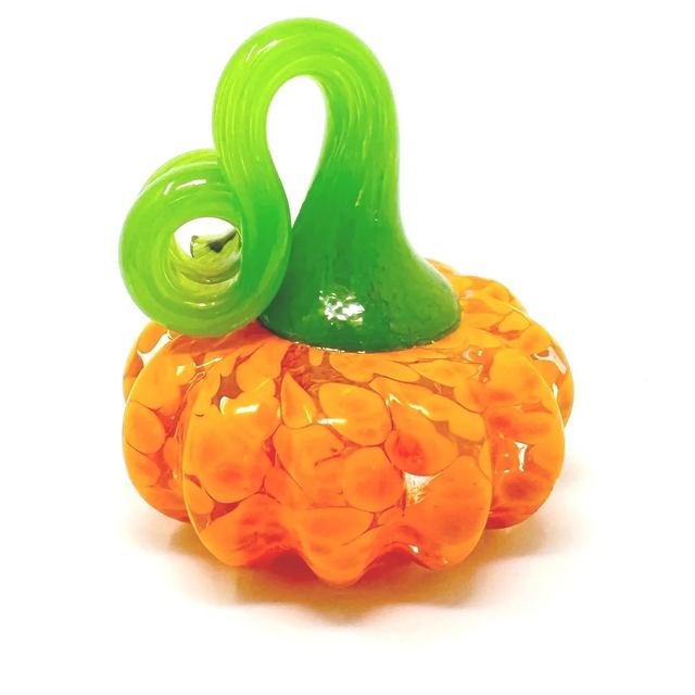 Small orange speckled glass pumpkin with a bright green curled stem.